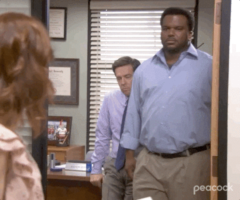 In The Office, Darryl and Andy close the door on Erin as she tries to peek through. [gif]
