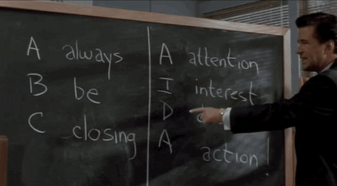 Alec Baldwin in Glengarry Glen Ross points to a chalkboard that says, "Always Be Closing" (gif)