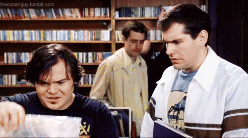 Working in a record store, Jack Black's character picks up a copy of Blonde on Blonde and looks at an unsuspecting plebe with sympathy. [High Fidelity movie gif]